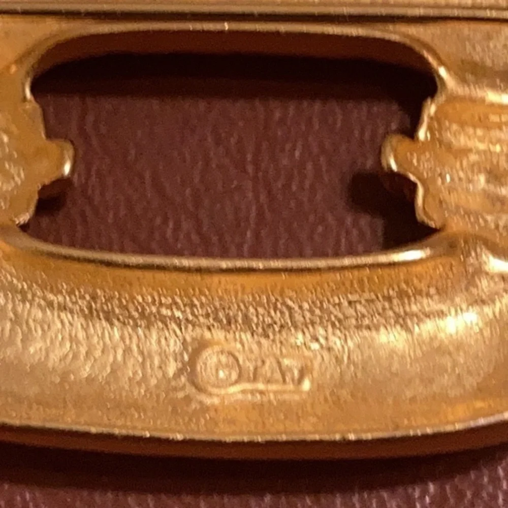 TAT signed gold tone Art Deco style pin